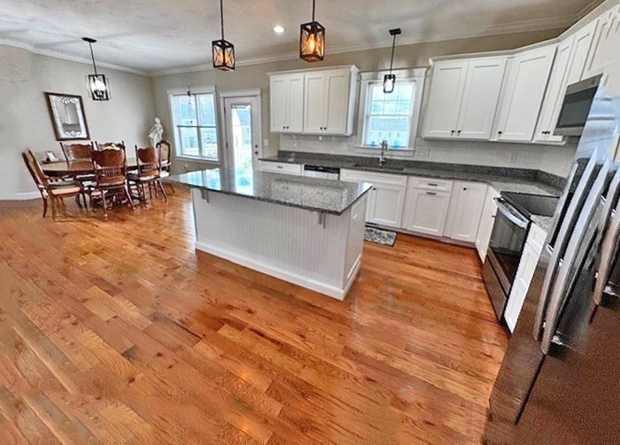 6 Nautical Way, Unit 122 Douglas, MA 01516 - Photo 14 of 42 a kitchen with stainless steel appliances granite countertop a stove a sink and a refrigerator