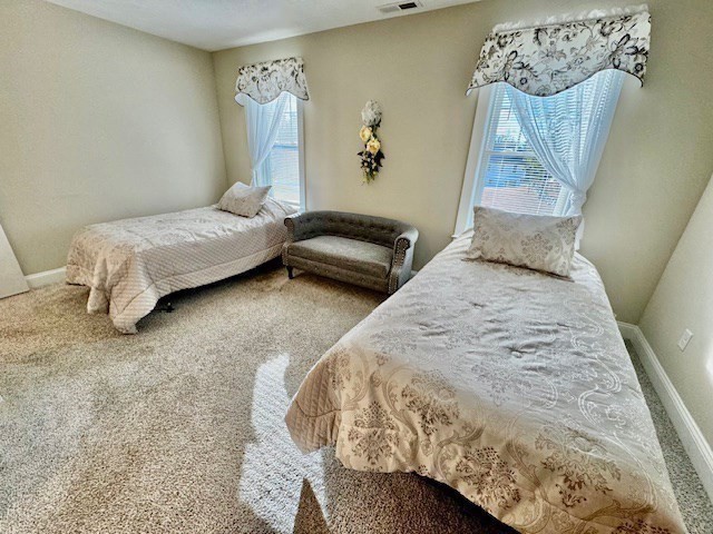 6 Nautical Way, Unit 122 Douglas, MA 01516 - Photo 20 of 42 a bedroom with a bed and wall painting