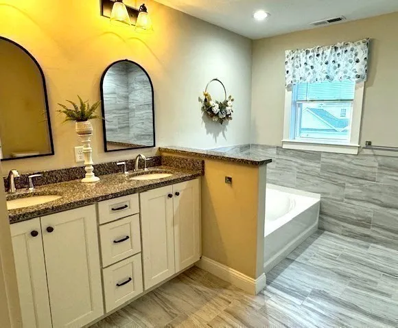 a bathroom with a sink and mirror