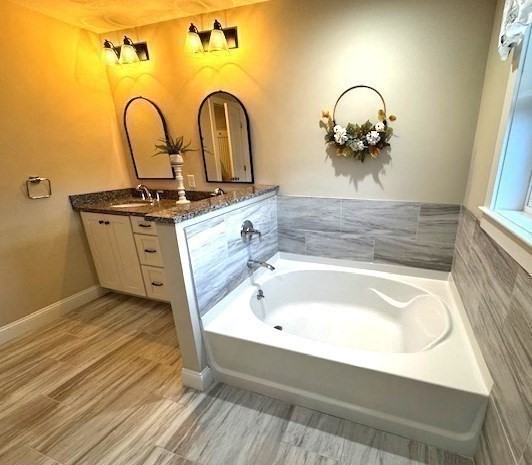 6 Nautical Way, Unit 122 Douglas, MA 01516 - Photo 25 of 42 a bathroom with a sink and mirror