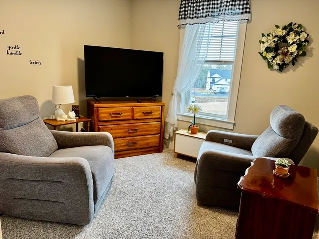 a living room with furniture and a gate
