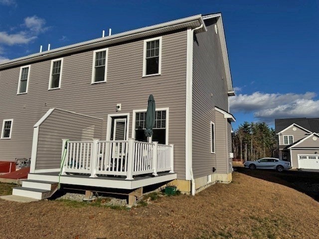 6 Nautical Way, Unit 122 Douglas, MA 01516 - Photo 3 of 42 a front view of a house with a yard