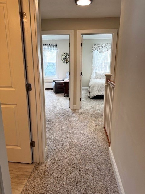 6 Nautical Way, Unit 122 Douglas, MA 01516 - Photo 33 of 42 a view of a bedroom with a furniture and mirror