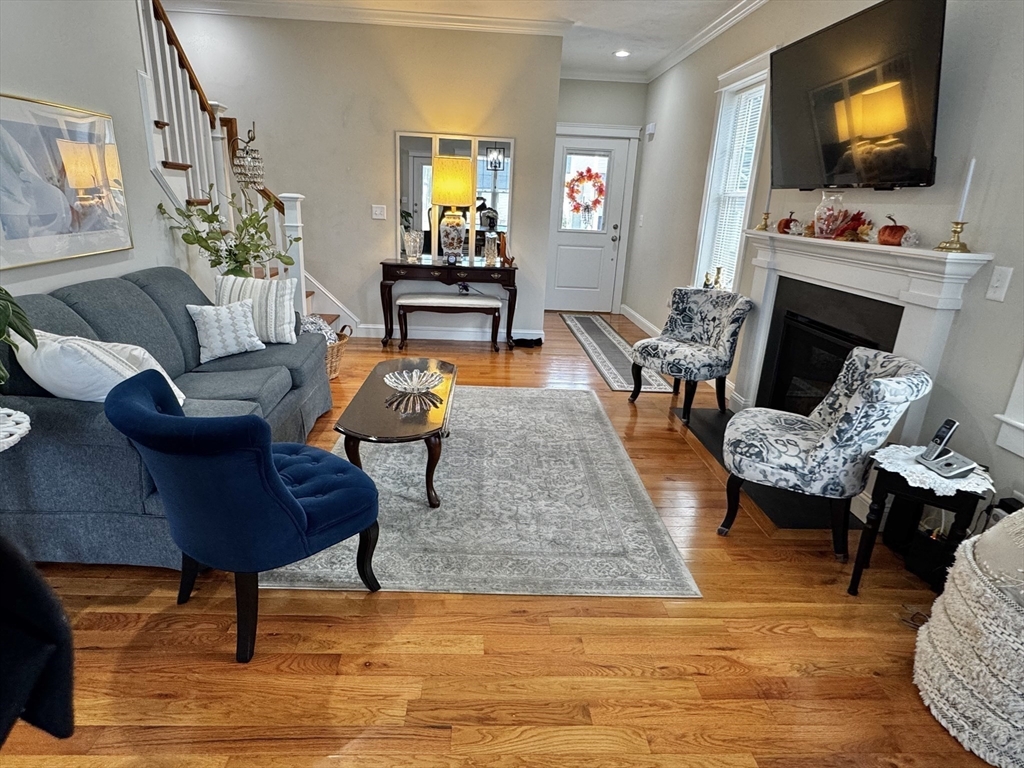 6 Nautical Way, Unit 122 Douglas, MA 01516 - Photo 7 of 42 a living room with furniture and a flat screen tv