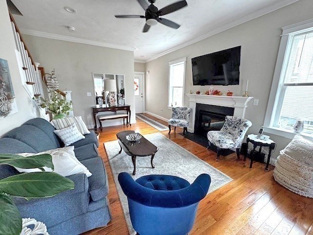 6 Nautical Way, Unit 122 Douglas, MA 01516 - Photo 8 of 42 a living room with furniture a flat screen tv and a fireplace