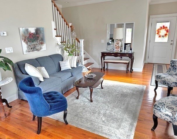 6 Nautical Way, Unit 122 Douglas, MA 01516 - Photo 9 of 42 a living room with furniture and a wooden floor