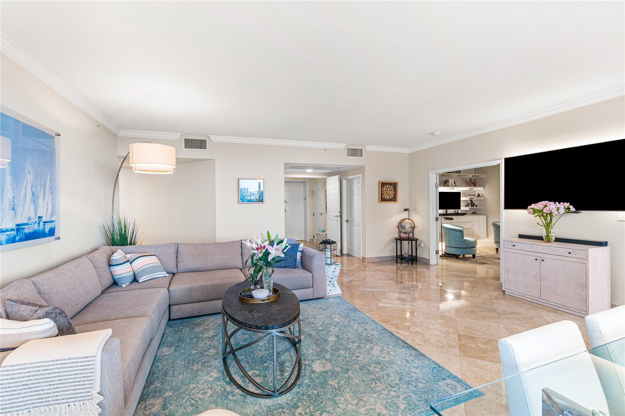 100 South Birch Road, Unit 904 Fort Lauderdale, FL 33316 - Photo 11 of 51 a living room with furniture and a flat screen tv
