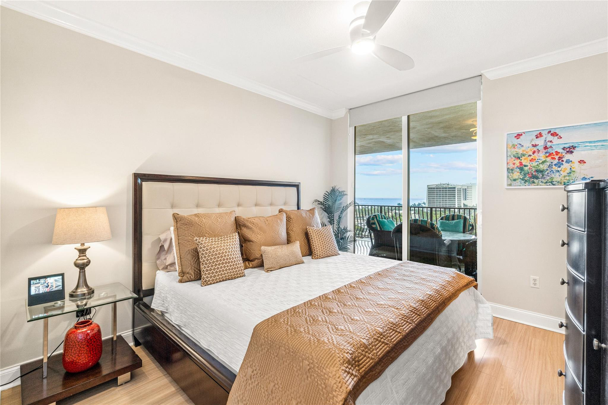 100 South Birch Road, Unit 904 Fort Lauderdale, FL 33316 - Photo 23 of 51 a bedroom with a bed and wooden floor