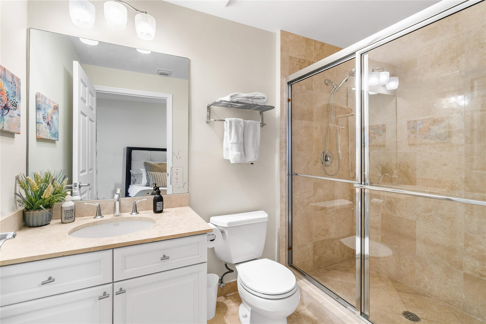 100 South Birch Road, Unit 904 Fort Lauderdale, FL 33316 - Photo 24 of 51 a bathroom with a shower sink vanity mirror and toilet