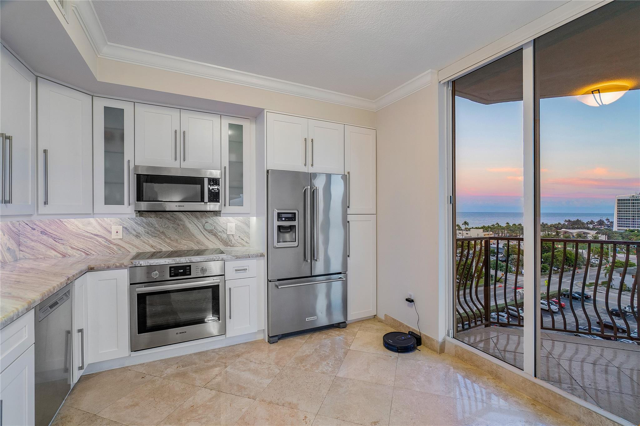 100 South Birch Road, Unit 904 Fort Lauderdale, FL 33316 - Photo 3 of 51 a kitchen with a stove and a refrigerator