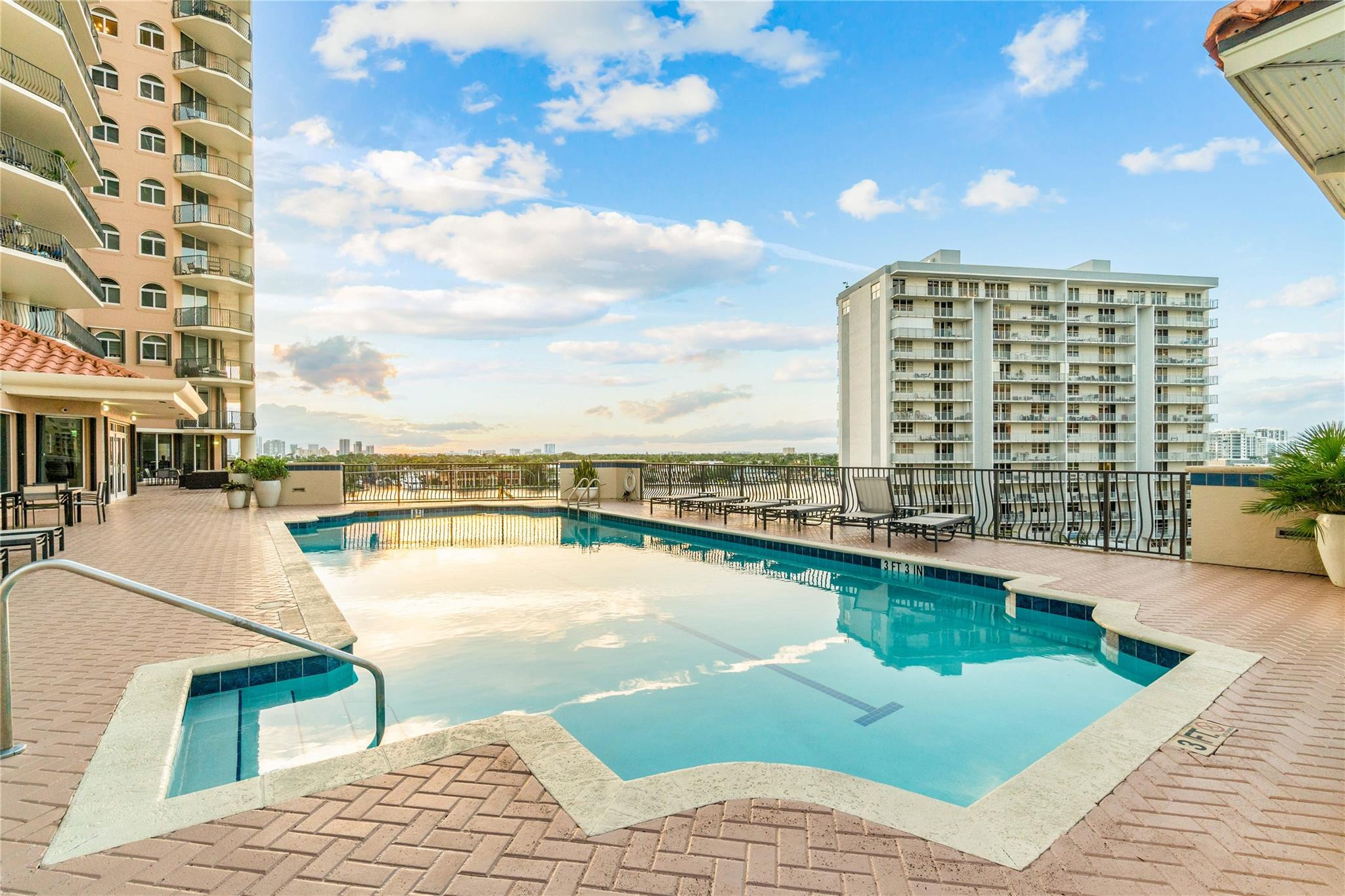 100 South Birch Road, Unit 904 Fort Lauderdale, FL 33316 - Photo 33 of 51 a view of a swimming pool with outdoor seating