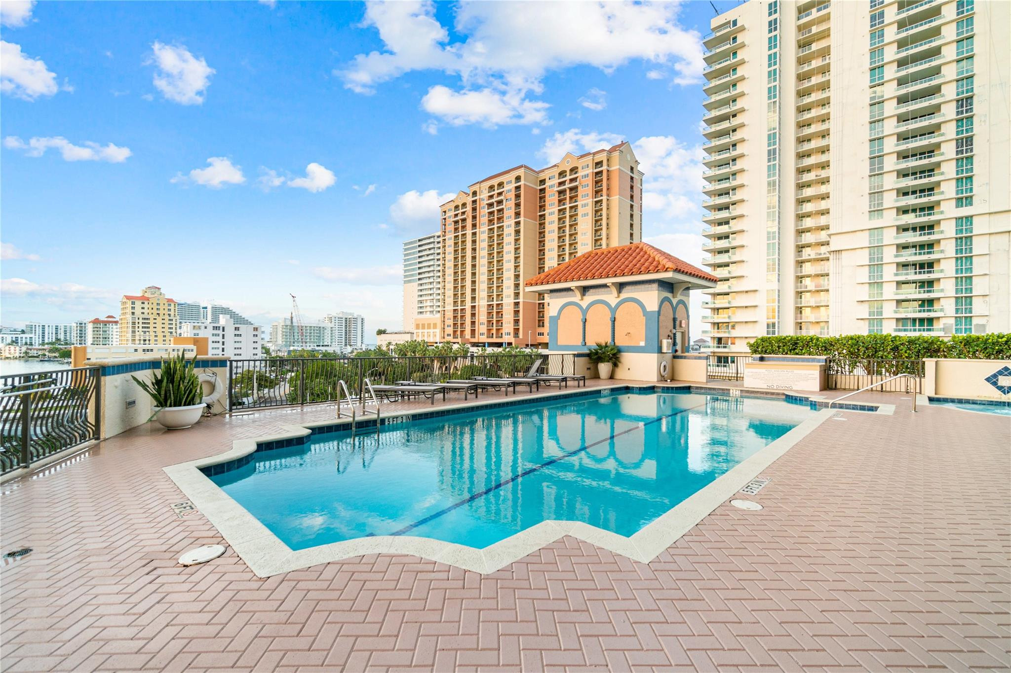 100 South Birch Road, Unit 904 Fort Lauderdale, FL 33316 - Photo 34 of 51 a view of a swimming pool with a lounge chair