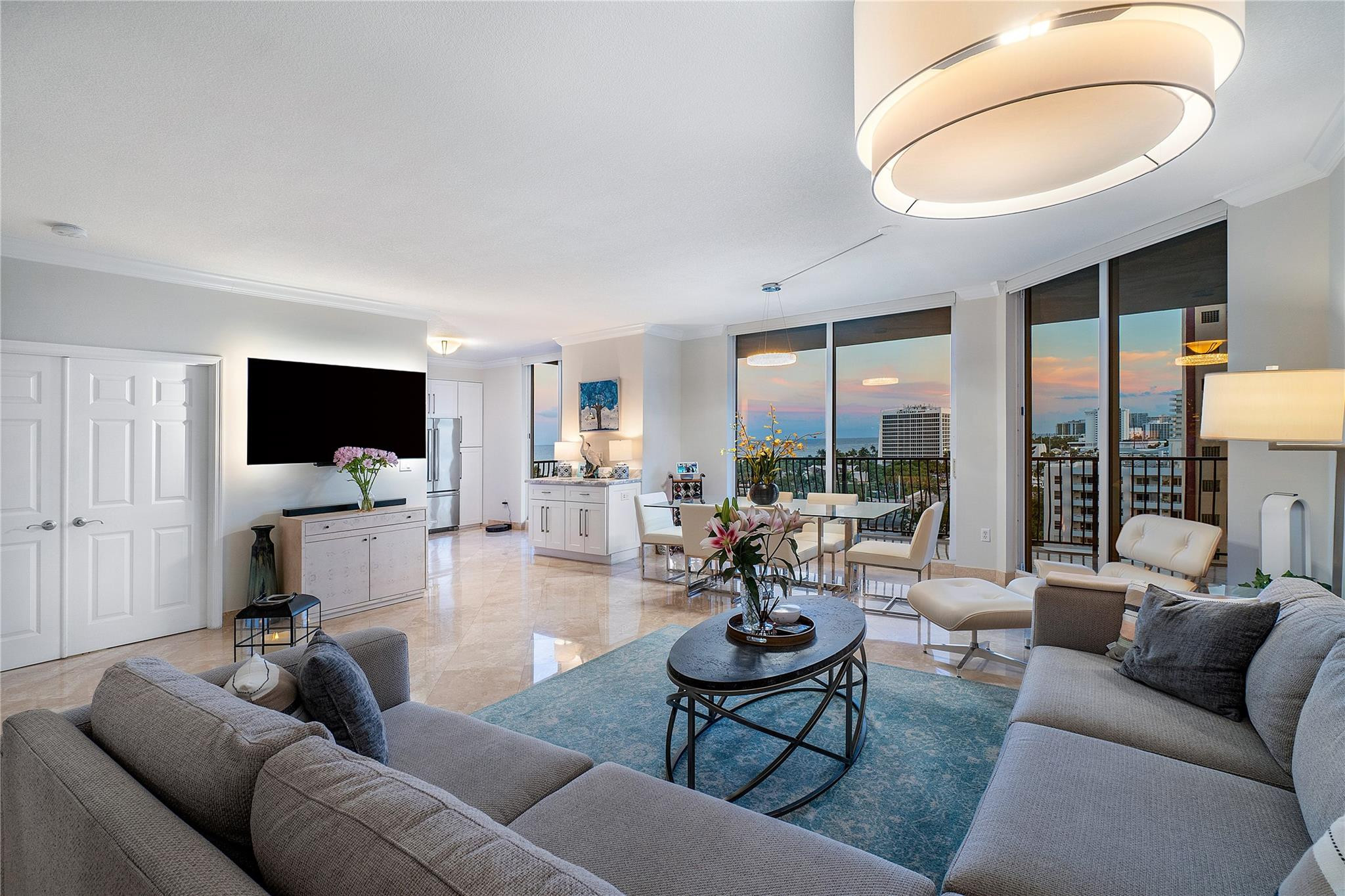100 South Birch Road, Unit 904 Fort Lauderdale, FL 33316 - Photo 51 of 51 a living room with furniture and a flat screen tv