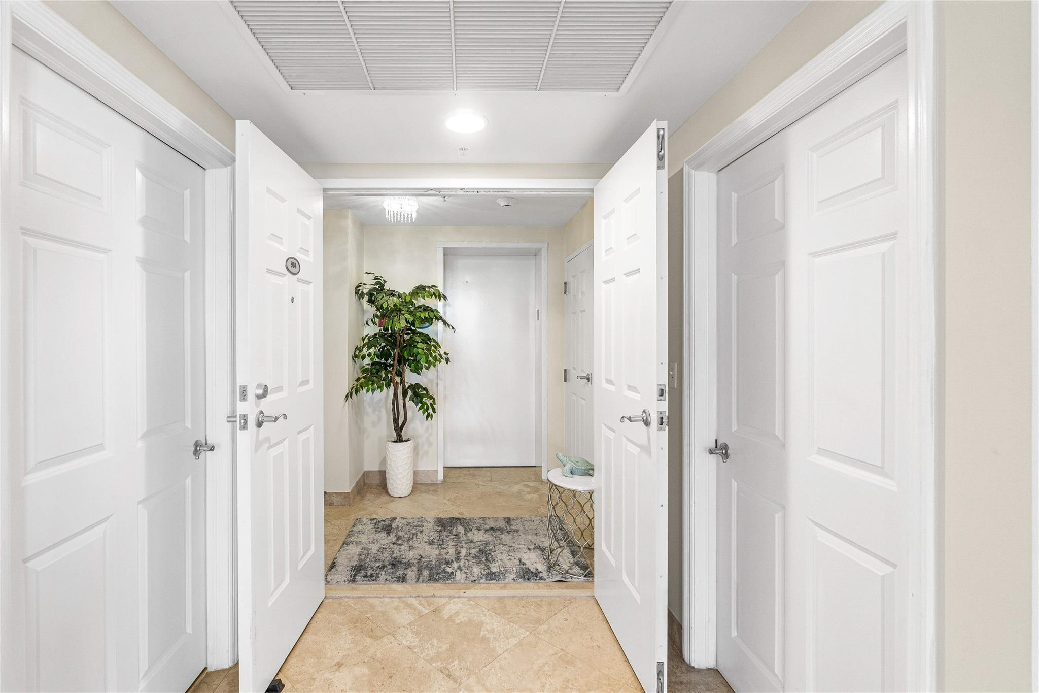 100 South Birch Road, Unit 904 Fort Lauderdale, FL 33316 - Photo 49 of 51 a view of a hallway to a livingroom with a hallway