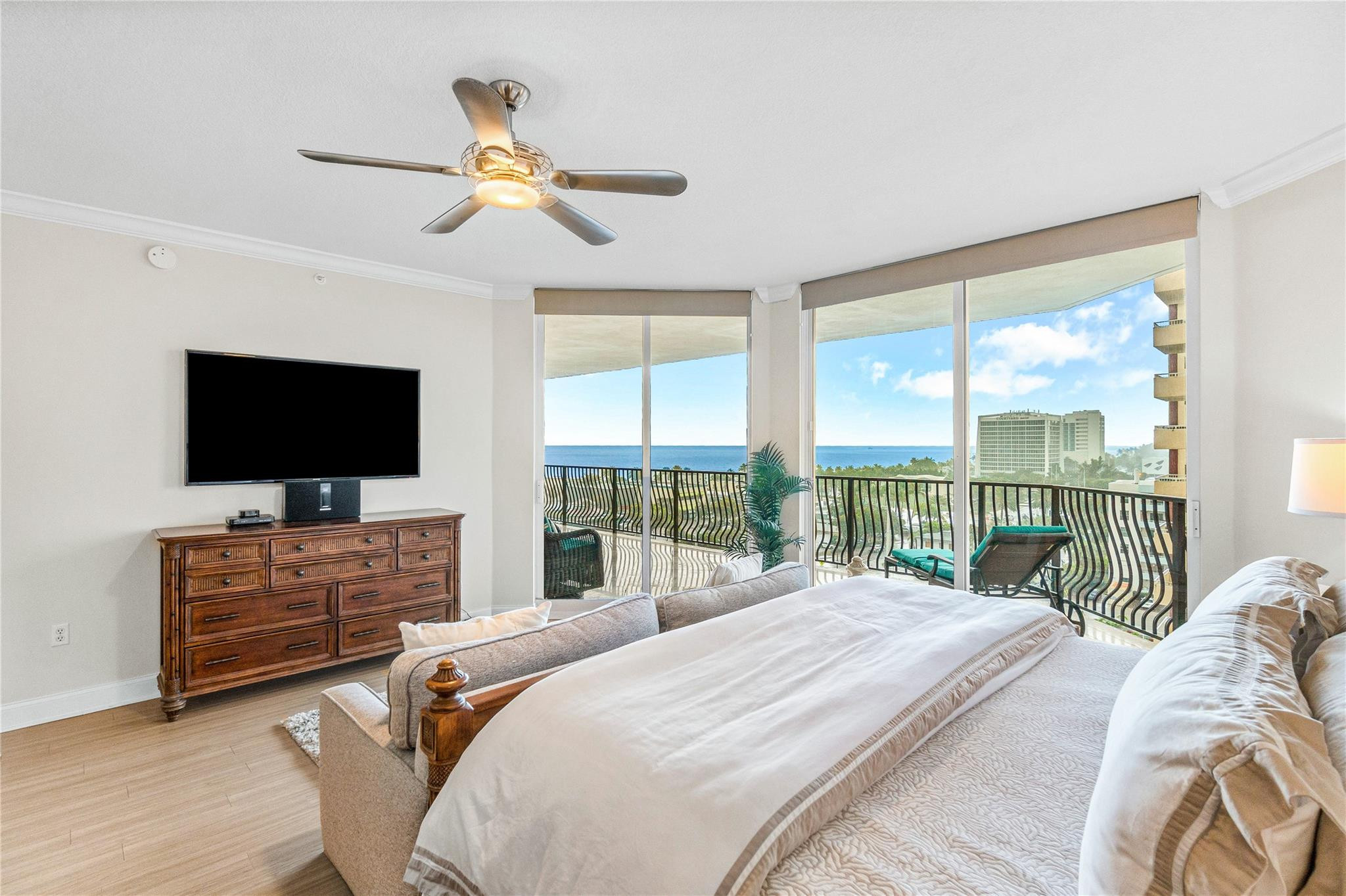 100 South Birch Road, Unit 904 Fort Lauderdale, FL 33316 - Photo 4 of 51 a bedroom with a bed and a flat screen tv
