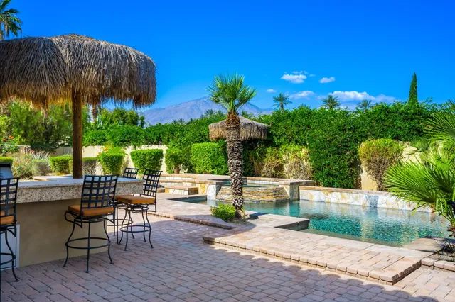 a bed room with a bed and a television