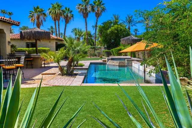 a bathroom with a bathtub a window and a shower