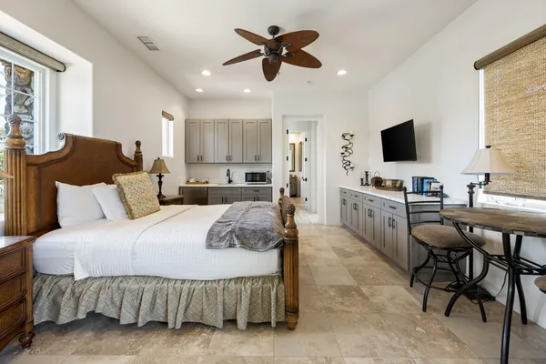 a spacious bathroom with a large tub sink and mirror