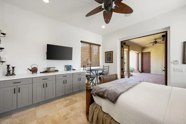 a bed sitting in a room next to a window