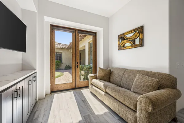 a front view of a building with sitting area