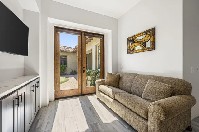 a front view of a building with sitting area