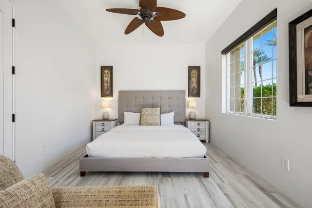 a view of a patio with table and chairs and potted plants
