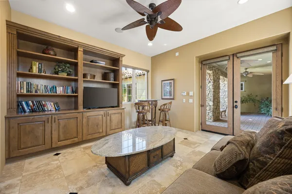 a view of a house with a yard and potted plants