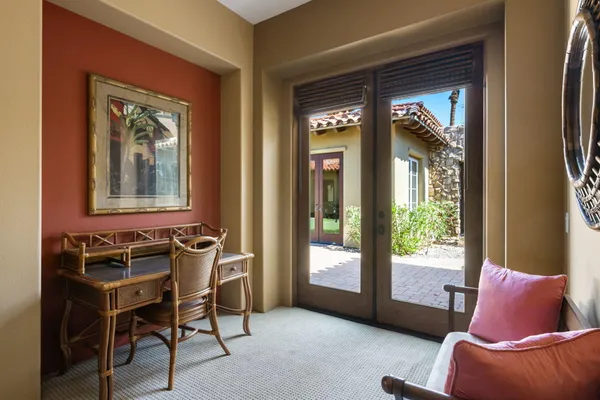 a view of a yard with cars parked