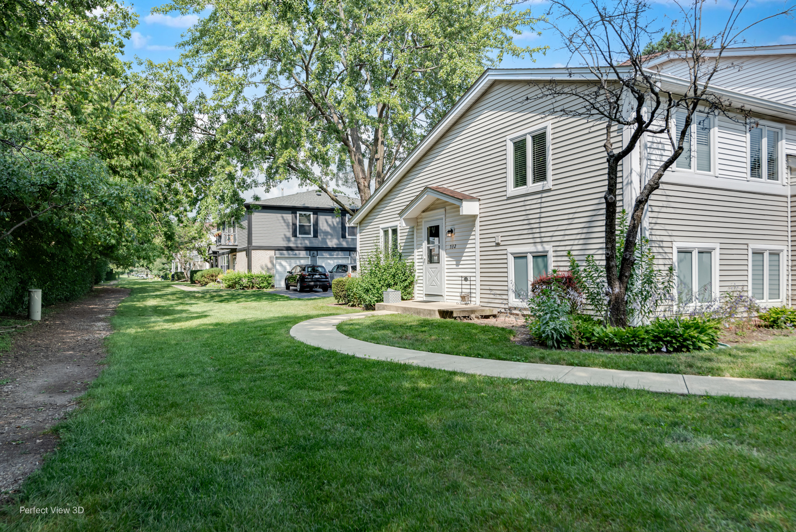 532 Inverrary Lane Deerfield, IL 60015 - Photo 2 of 23 a front view of a house with a garden and trees