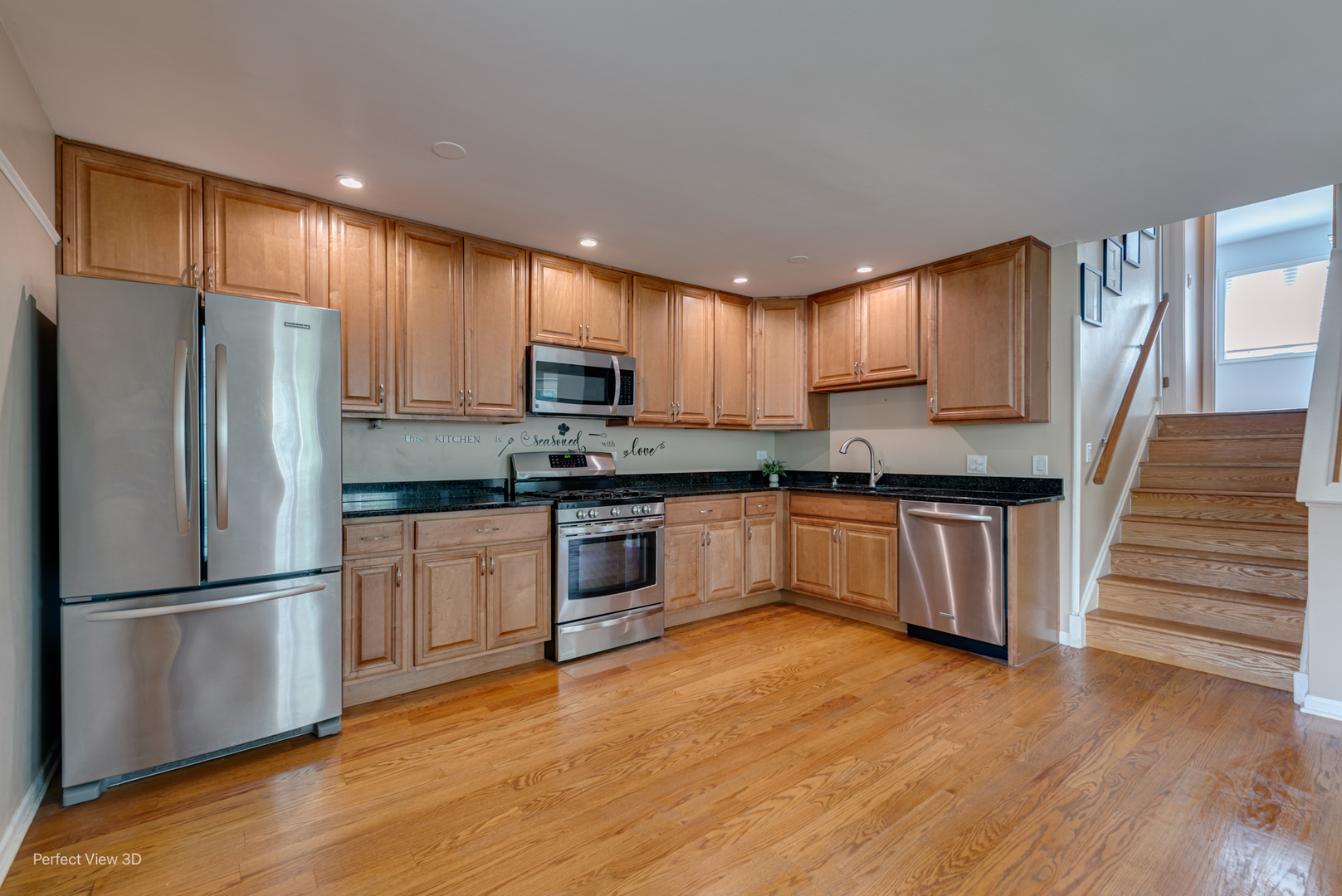532 Inverrary Lane Deerfield, IL 60015 - Photo 6 of 23 a kitchen with wooden floors white cabinets and stainless steel appliances