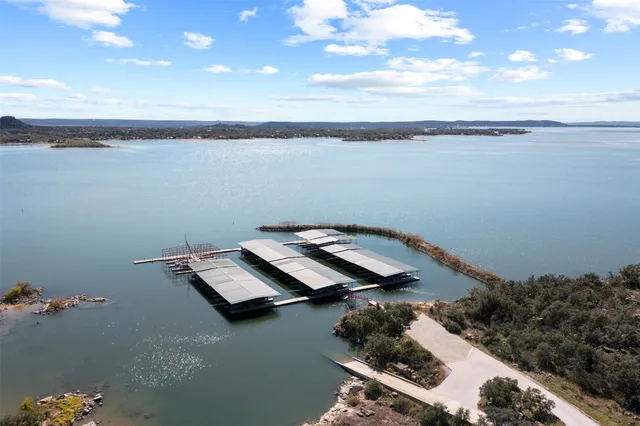 a view of a chairs and table in the balcony