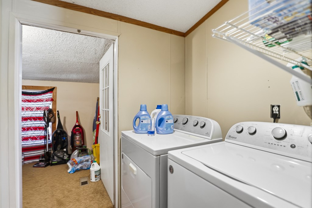 912 Alamo Road Fredericksburg, TX 78624 - Photo 15 of 21 a view of storage and utility room with washer and dryer