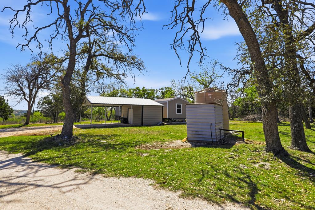 912 Alamo Road Fredericksburg, TX 78624 - Photo 18 of 21 a house view with a garden space