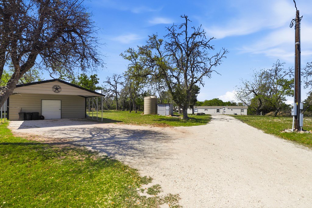912 Alamo Road Fredericksburg, TX 78624 - Photo 2 of 21 a view of pool with tree s
