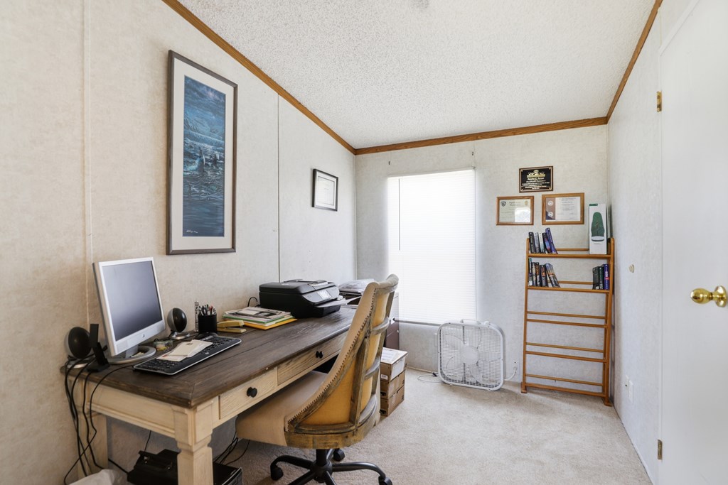 912 Alamo Road Fredericksburg, TX 78624 - Photo 10 of 21 a view of a workspace with furniture and cabinet
