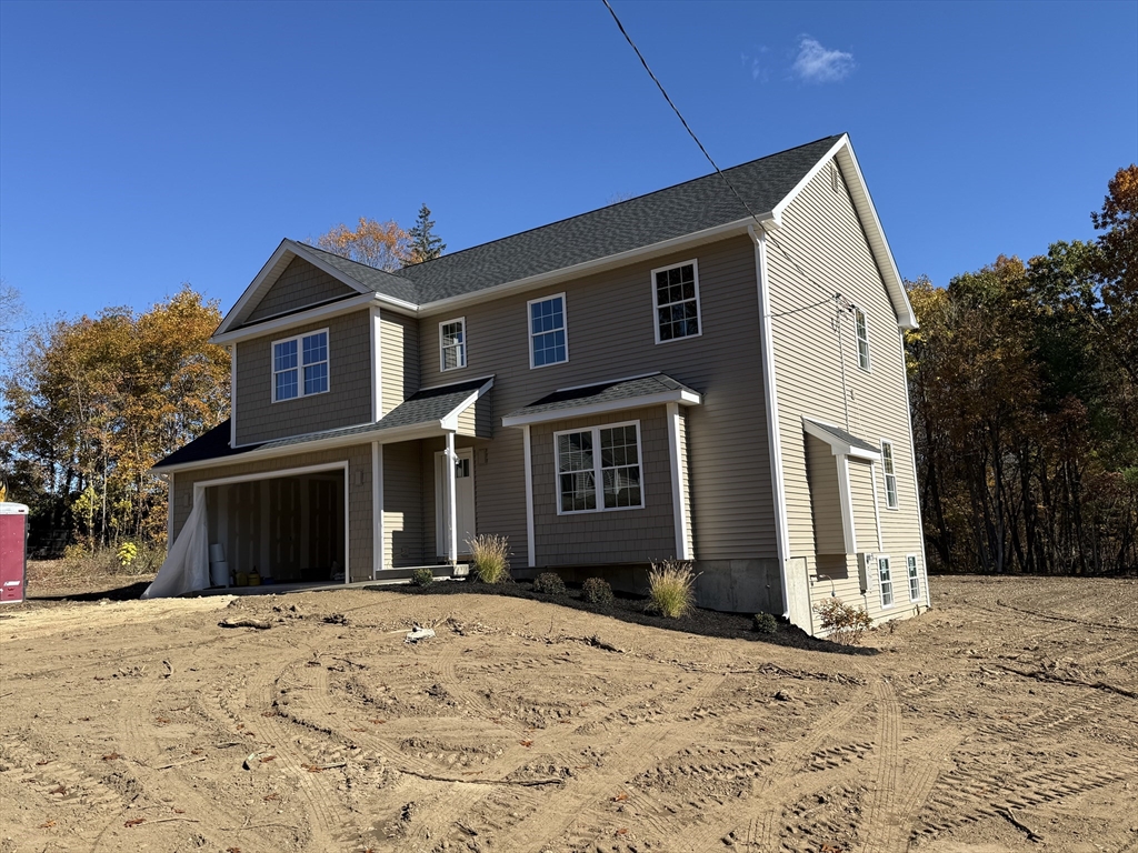 41 Deroche Circle Ludlow, MA 01056 - Photo 3 of 16 a front view of a house with a yard