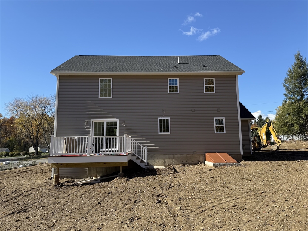 41 Deroche Circle Ludlow, MA 01056 - Photo 4 of 16 a front view of a house with a yard