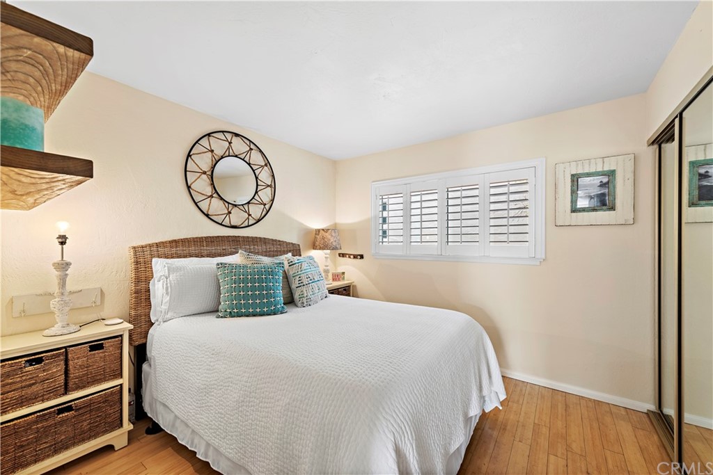 312 Avenida Granada, Unit A San Clemente, CA 92672 - Photo 18 of 25 a bedroom with a bed and a window