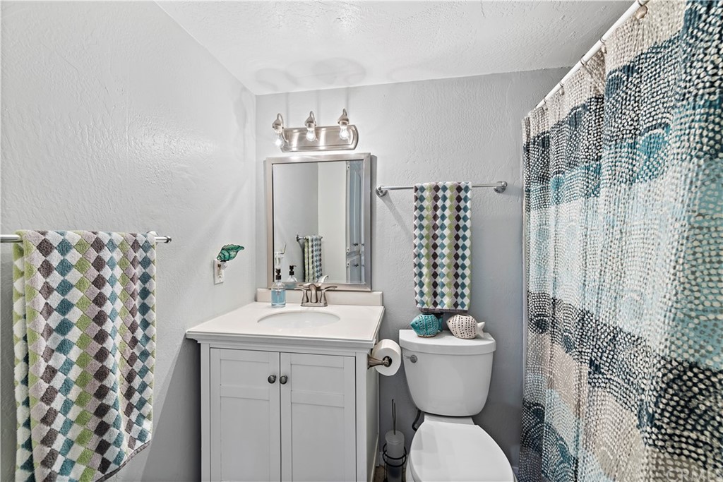 312 Avenida Granada, Unit A San Clemente, CA 92672 - Photo 20 of 25 a bathroom with a sink toilet and shower