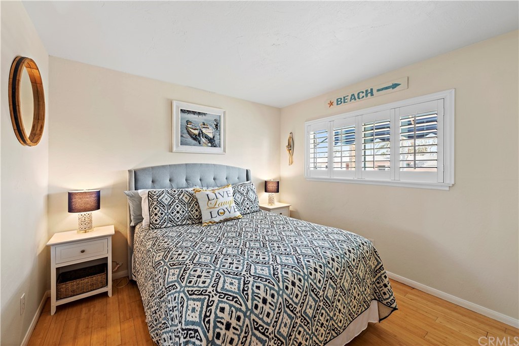312 Avenida Granada, Unit A San Clemente, CA 92672 - Photo 21 of 25 a bedroom with a bed and a window