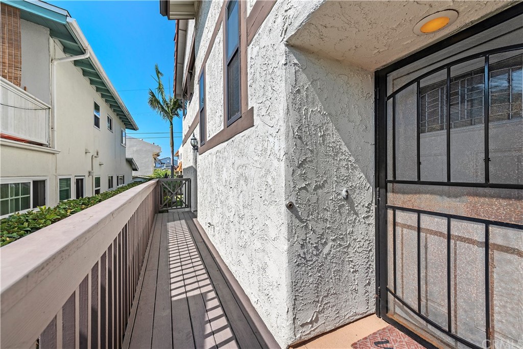 312 Avenida Granada, Unit A San Clemente, CA 92672 - Photo 22 of 25 a view of balcony with wooden floor