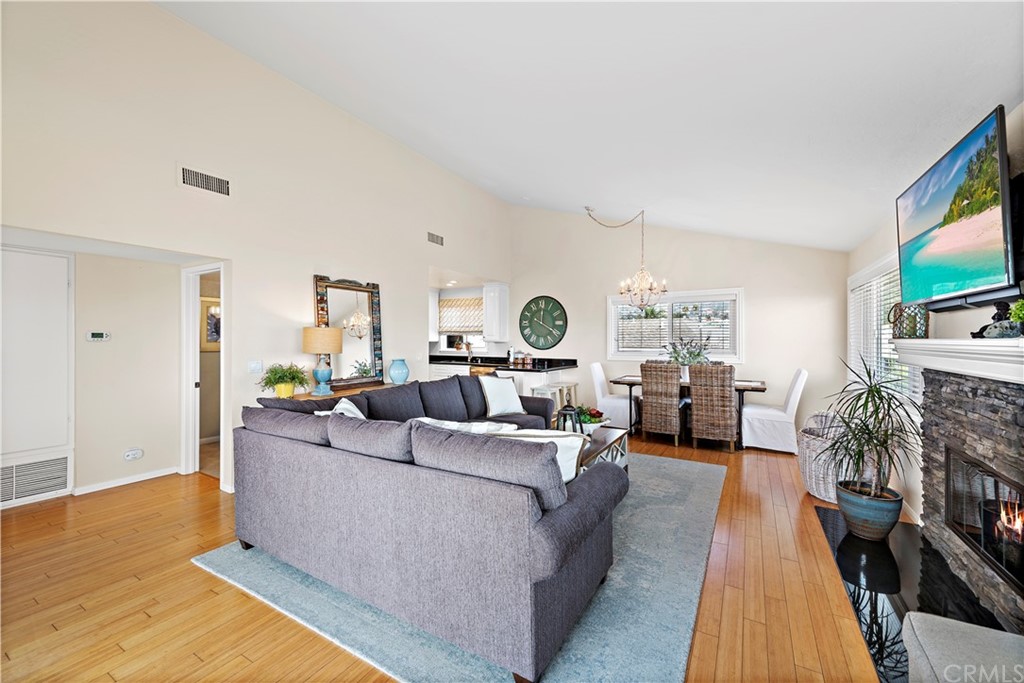 312 Avenida Granada, Unit A San Clemente, CA 92672 - Photo 7 of 25 a living room with furniture a flat screen tv and a rug