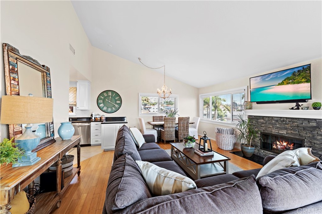312 Avenida Granada, Unit A San Clemente, CA 92672 - Photo 8 of 25 a living room with furniture and a fireplace