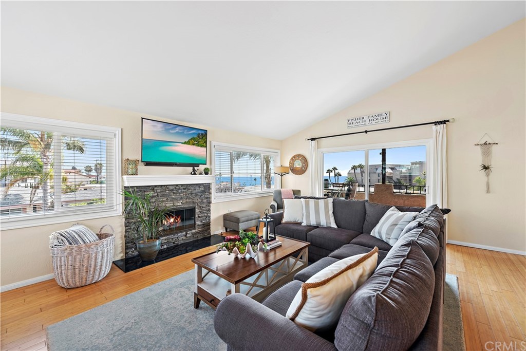 312 Avenida Granada, Unit A San Clemente, CA 92672 - Photo 10 of 25 a living room with furniture and a fireplace