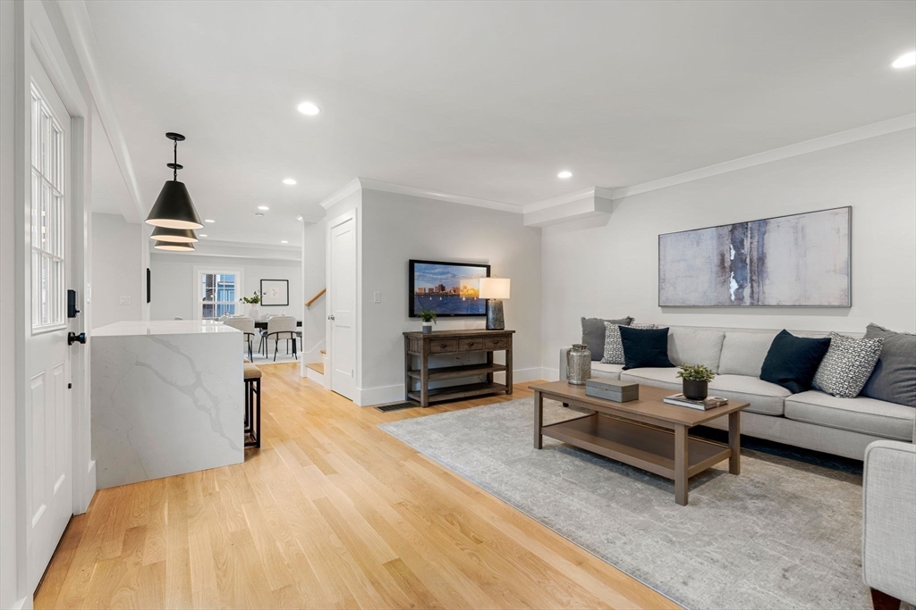 143 Derby Street, Unit 1 Salem, MA 01970 - Photo 20 of 42 a living room with furniture and a wooden floor