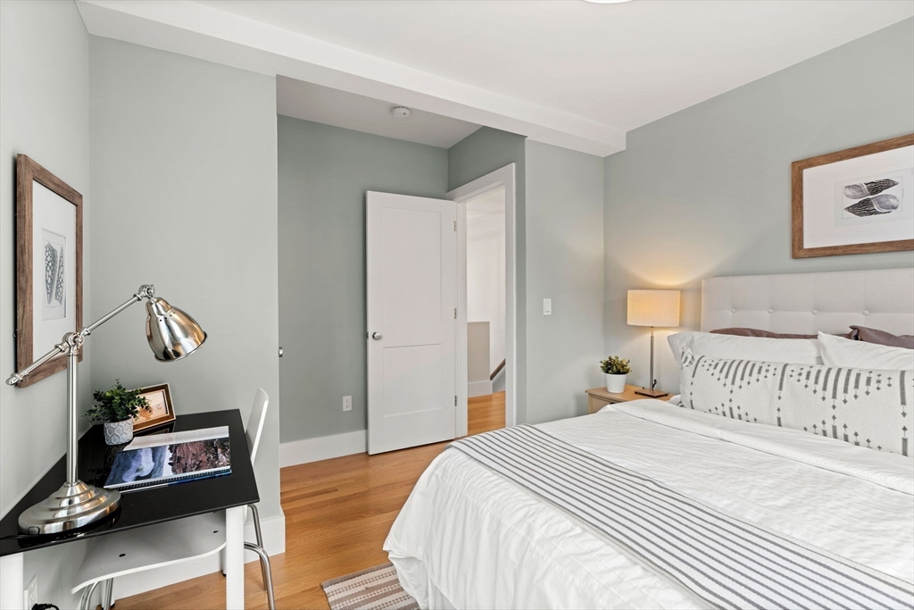 143 Derby Street, Unit 1 Salem, MA 01970 - Photo 25 of 42 a bedroom with a bed and a window