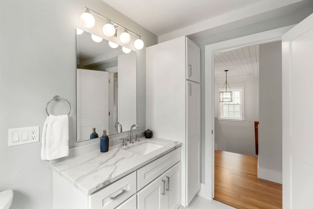 143 Derby Street, Unit 1 Salem, MA 01970 - Photo 27 of 42 a bathroom with a sink and a mirror