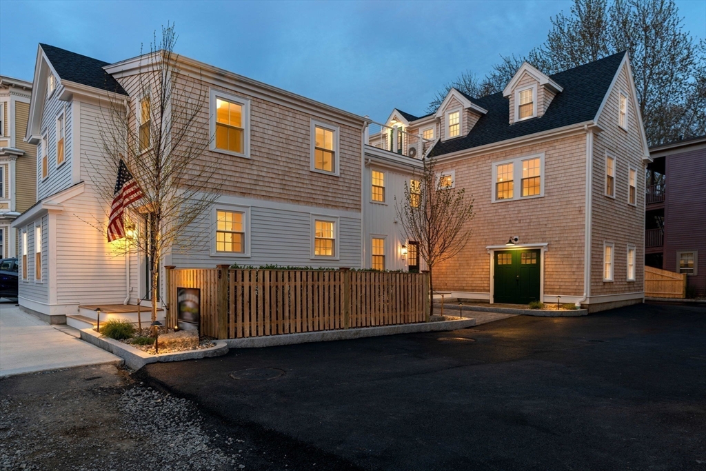 143 Derby Street, Unit 1 Salem, MA 01970 - Photo 3 of 42 a front view of a house with a yard