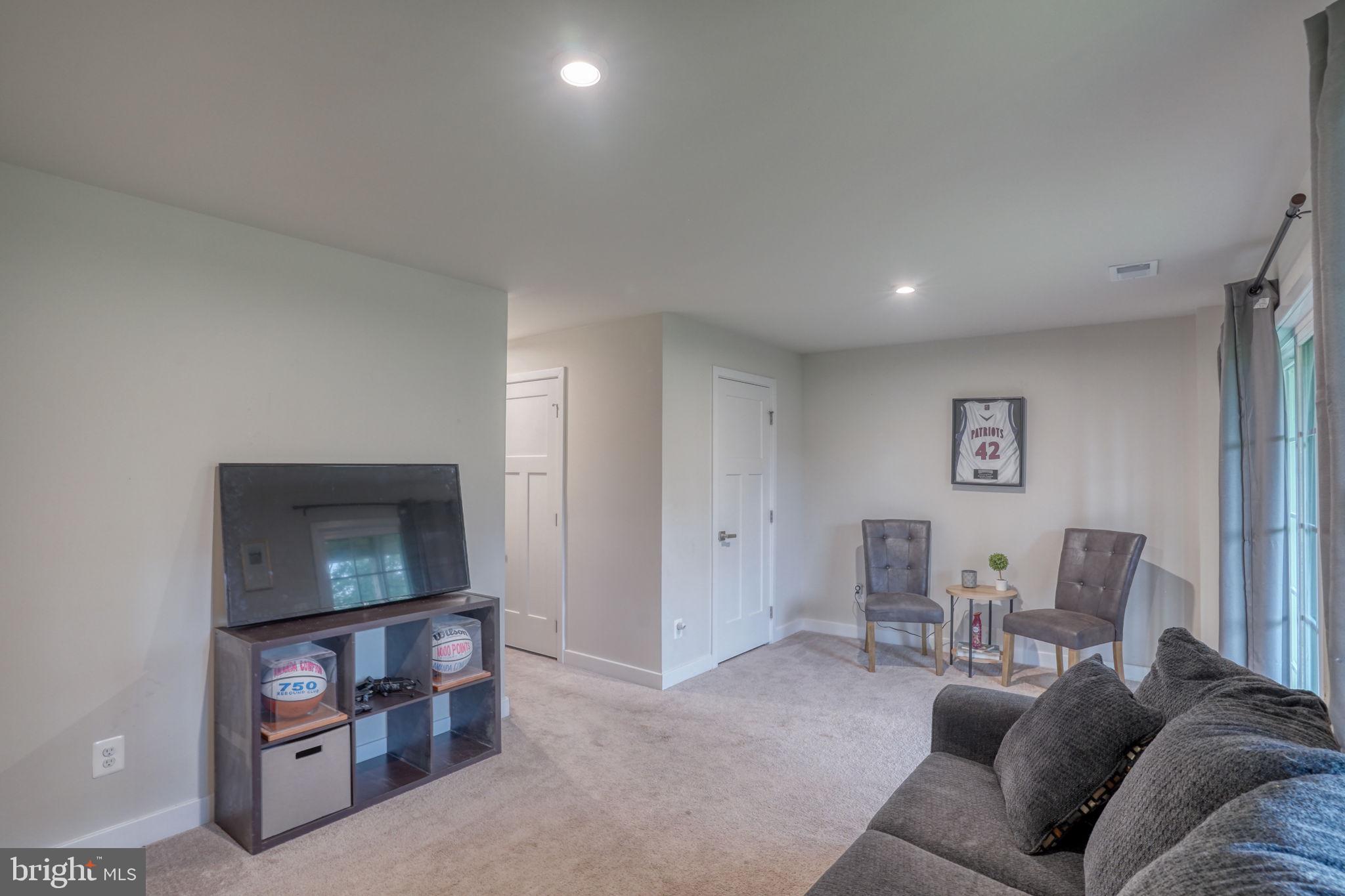 1944 Spearfish Court Newark, DE 19702 - Photo 13 of 44 a living room with furniture and a wooden floor
