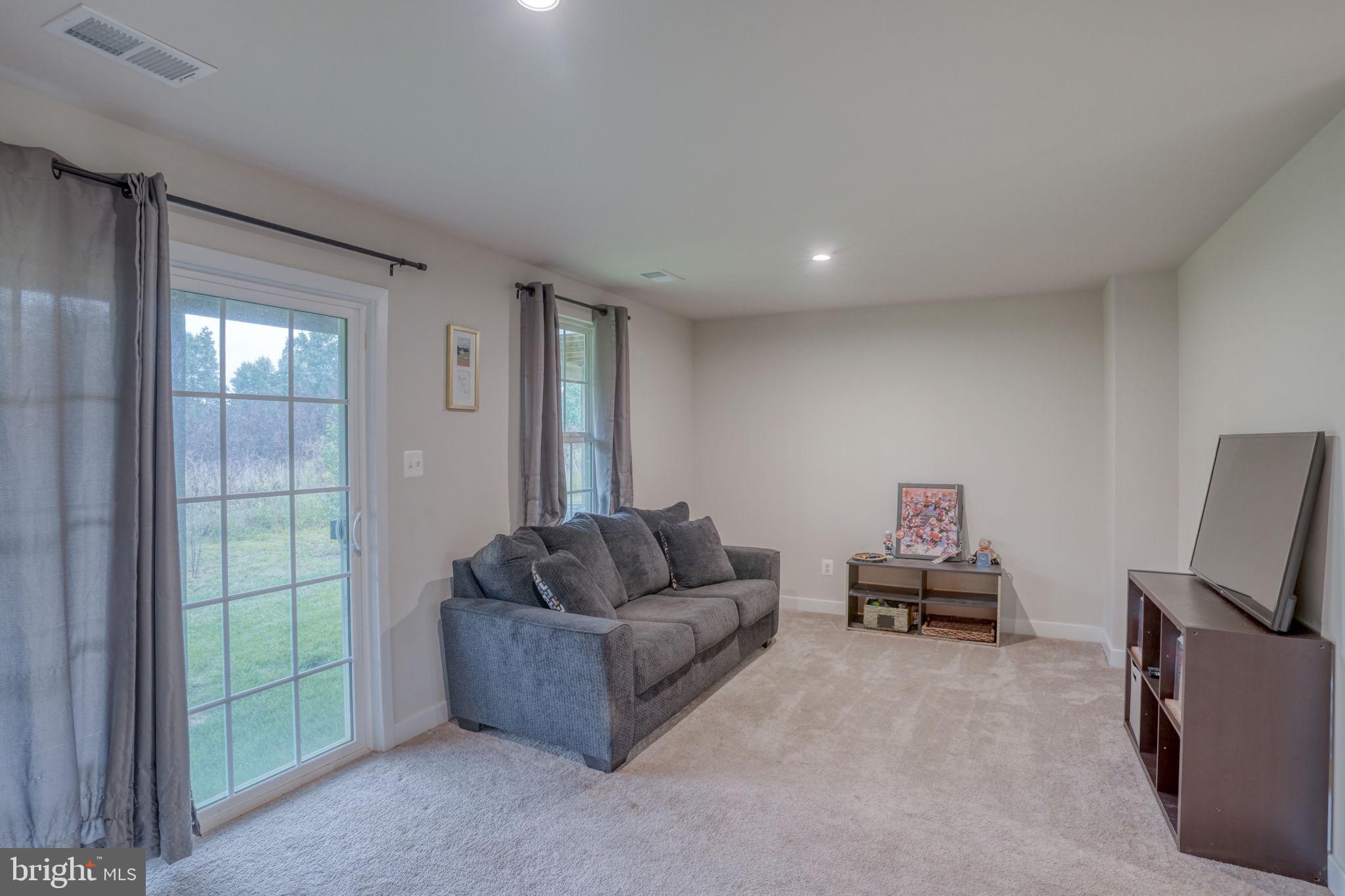 1944 Spearfish Court Newark, DE 19702 - Photo 14 of 44 a living room with furniture and a flat screen tv